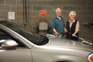 Couple washing their car