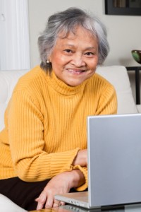 Smiling woman with laptop